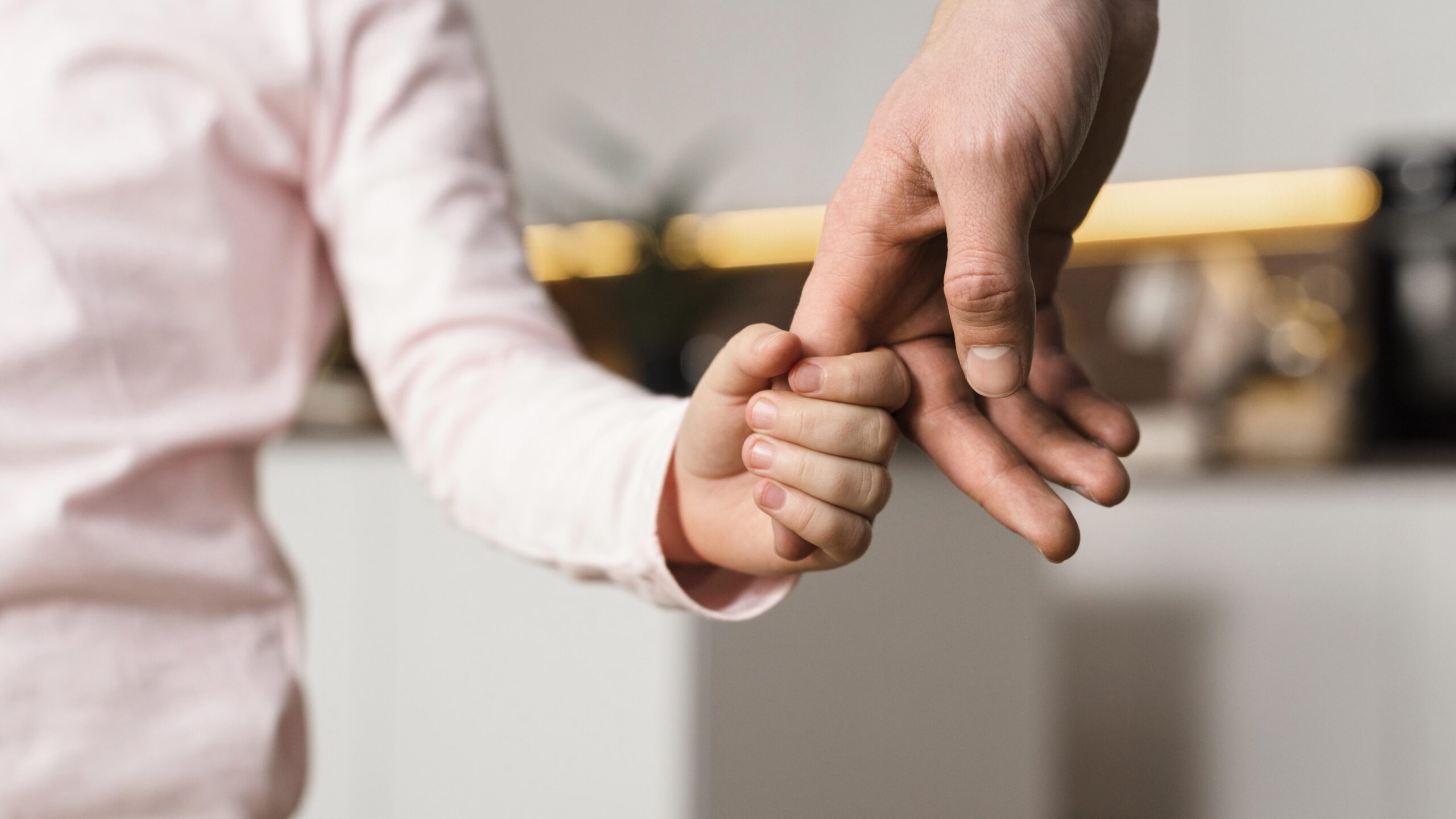 little-girl-holding-hands-with-father